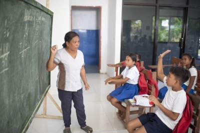 A teacher with young students 