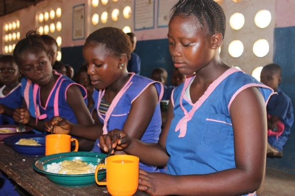 Three girls having their school meal. 