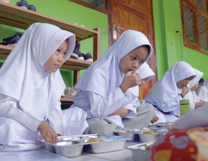 Children eating school meals in Sukabumi, Indonesia.