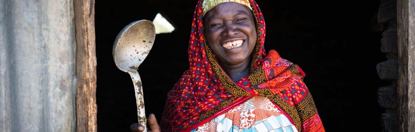 Women holding a large spoon