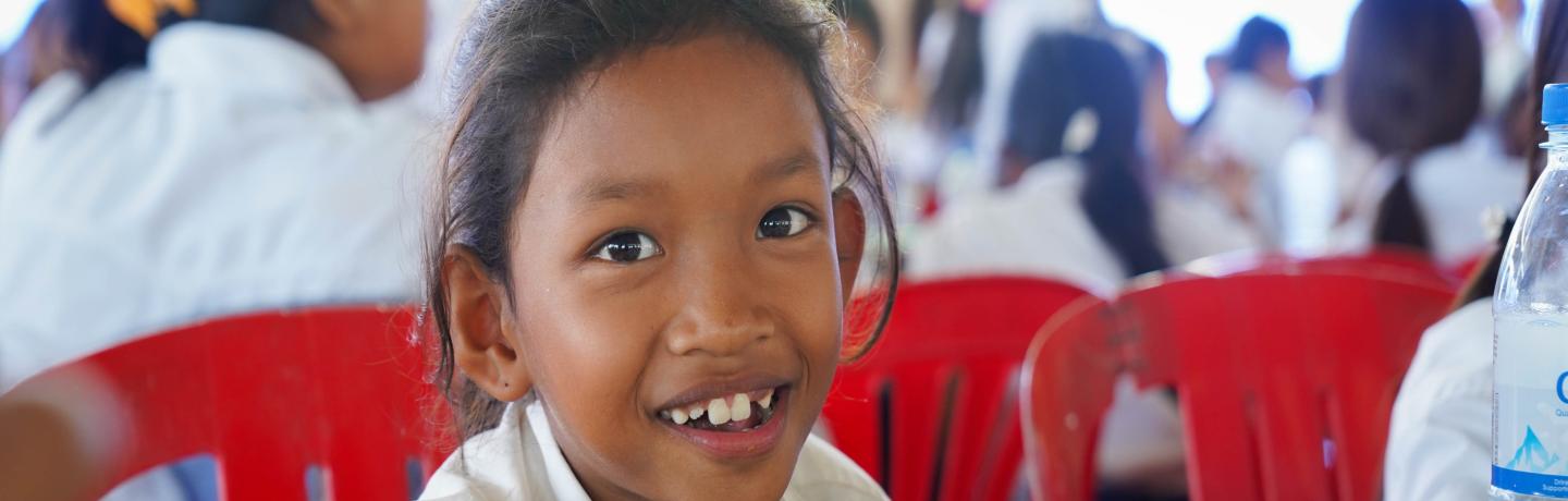 Smiling girl eating lunch