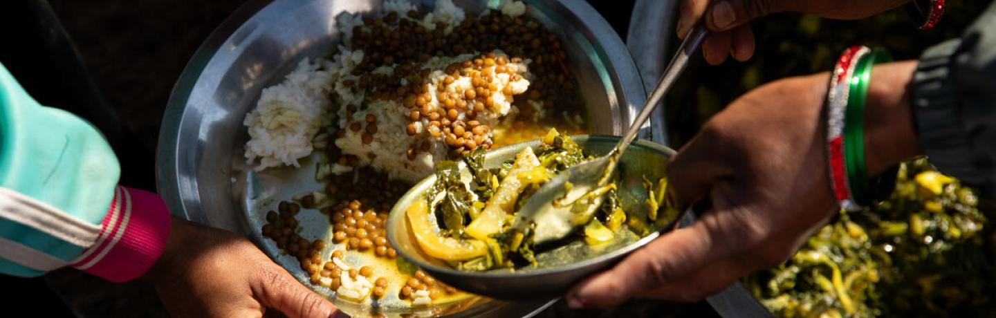 A photo of a plate of food, part of the school meals provided to kids in Nepal