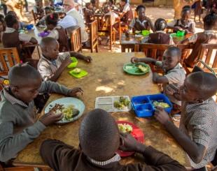 Children in Zambia enjoying a healthy lunch in a school cafeteria