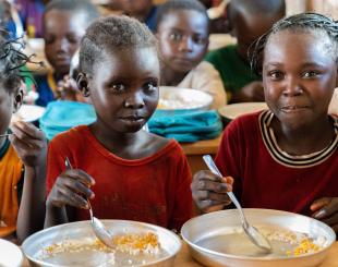 Children enjoy their lunch meal at a school in CAR
