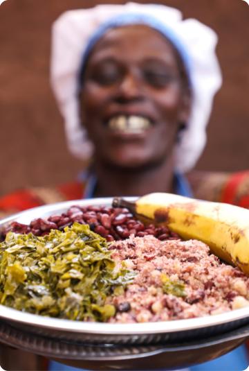 A woman holding a plate of food