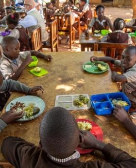 Children in Zambia enjoying a healthy lunch in a school cafeteria